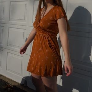 Rust colored floral wrap dress with belt